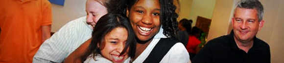 students hugging and smiling